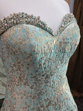 Load image into Gallery viewer, Mac Duggal 66740M Size 6 Aqua  ice blue formal dress features a mermaid silhouette in jacquard, with beading accent on the collared strapless sweetheart neckline. The semi-open back is offset with a chapel train. Mermaid style gown, strapless sweetheart neckline, brocade has gold shine, dramatic train , zipper closure 
