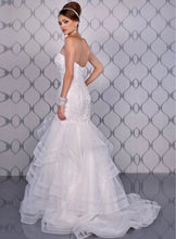 Load image into Gallery viewer, Adagio Bridal ivory wedding gown Size 6 Style : W9233 This mermaid , fit n flare gown has a lace and beaded detailed bodice ,corset back. The skirt is a full layered skirt lined with a horsehair trim, chapel length train. 
