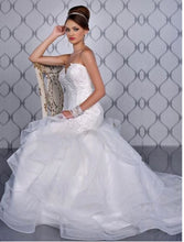 Load image into Gallery viewer, Adagio Bridal ivory wedding gown Size 6 Style : W9233 This mermaid , fit n flare gown has a lace and beaded detailed bodice ,corset back. The skirt is a full layered skirt lined with a horsehair trim, chapel length train. 
