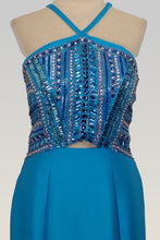 Load image into Gallery viewer, Rachel Allan #E1063 Size 6 Color Turquoise This Mermaid style prom gown has Mikado fabric (no stretch), open back with crisscross 1&quot; straps, fun multi layered hemline with long flounce that adds movement and interest to this fun look the hem has horsehair to add more definition along with a crisp edge , it is fully lined and includes a crinoline ;petticoat, Zipper closure. 
