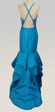 Load image into Gallery viewer, Rachel Allan #E1063 Size 6 Color Turquoise This Mermaid style prom gown has Mikado fabric (no stretch), open back with crisscross 1&quot; straps, fun multi layered hemline with long flounce that adds movement and interest to this fun look the hem has horsehair to add more definition along with a crisp edge , it is fully lined and includes a crinoline ;petticoat, Zipper closure. 
