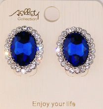 Load image into Gallery viewer, Ashley Collections post earrings ; Post/stud style earrings, oval shape, blue Sapphire stone with faucet cuts adding more sparkle , crystal rhinestone trim ; made in china 
