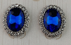 Ashley Collections post earrings ; Post/stud style earrings, oval shape, blue Sapphire stone with faucet cuts adding more sparkle , crystal rhinestone trim ; made in china 