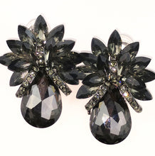 Load image into Gallery viewer, Fashion Jewelry black crystal clip earrings Clip style earrings 2&quot; long 1 3/4 &quot; wide Black onyx crystal, unique design includes a offset of marque with tear drop along with black crystal banding inset into the look, quality mount with silver lead and nickel free  made in china 
