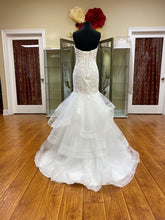 Load image into Gallery viewer, Adagio Bridal ivory wedding gown Size 6 Style : W9233 This mermaid , fit n flare gown has a lace and beaded detailed bodice ,corset back. The skirt is a full layered skirt lined with a horsehair trim, chapel length train. 
